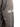 Close-up of the embroidered Stone Island compass badge on the left sleeve of the brown Denims hooded jacket